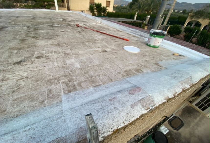 Terrace before waterproofing, worn surface prepared with fibreglass membrane